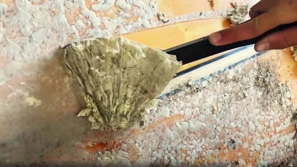 How to remove old wax from a surfboard?